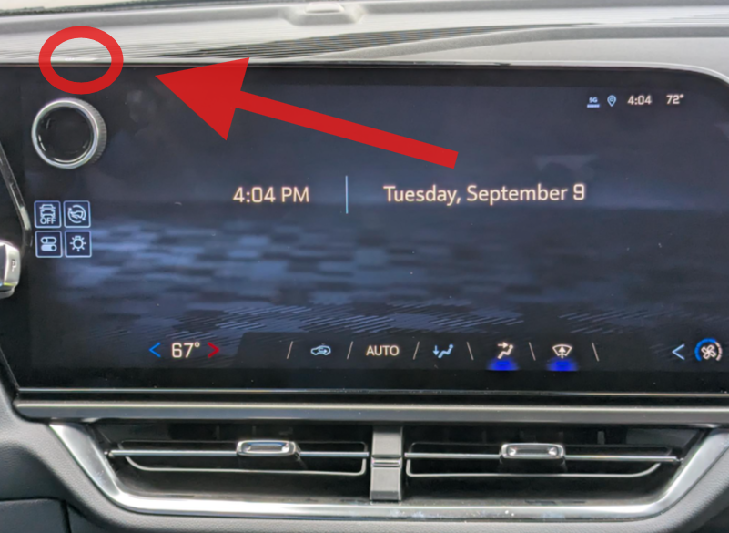 photo of Equinox Infotainment screen, with flat physical top power button circled with arrow pointing to it